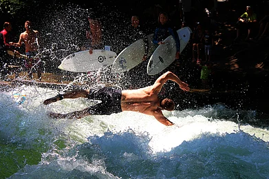 RM Productions/Shutterstock : A surfer at the Eisbach river